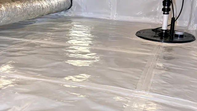 Finished Hampton Roads crawl space with a sealed white liner and a covered sump pump basin.