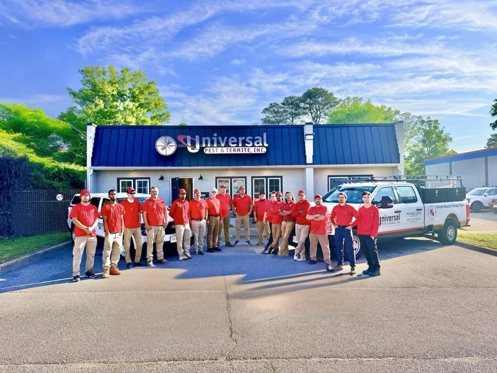 The Universal Pest & Termite crew and service trucks outside the company's Hampton Roads shop